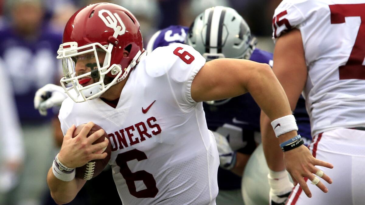 Oklahoma quarterback Baker Mayfield (6) scrambles for a 34-yard gain against Kansas State during the first half Saturday.