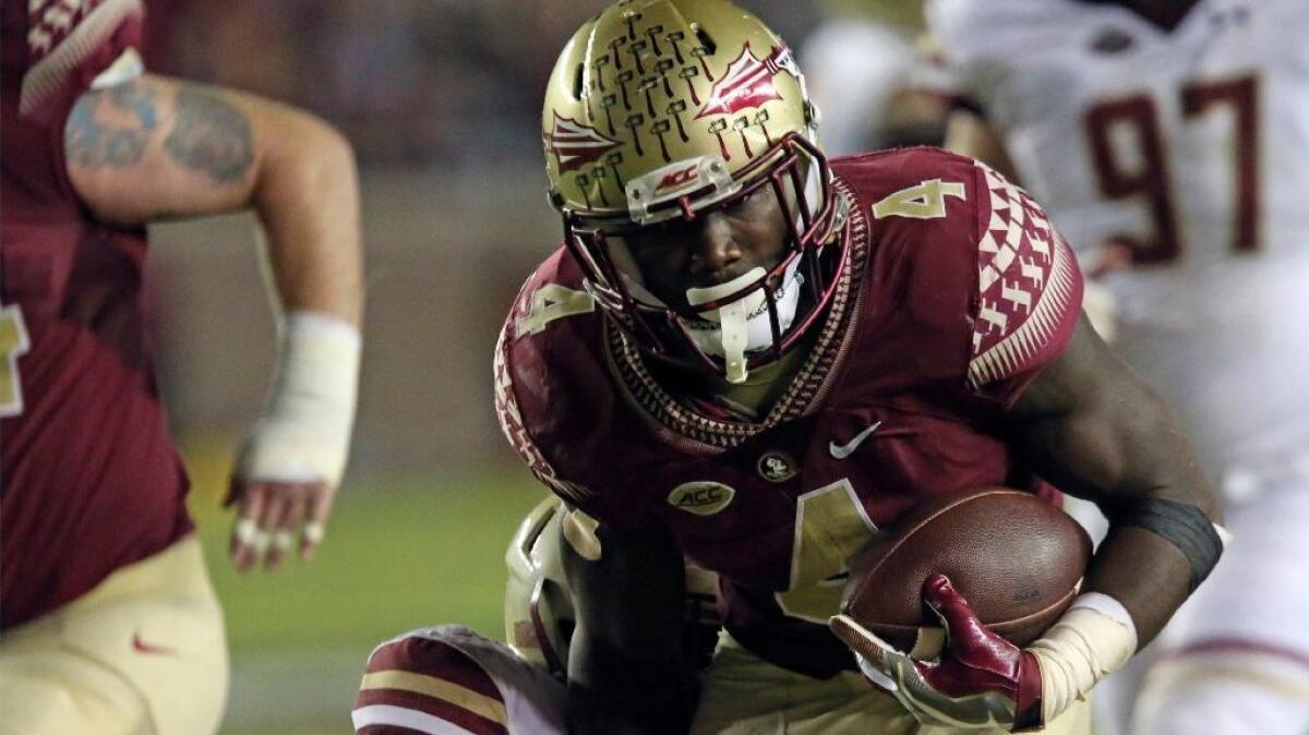 Florida State running back Dalvin Cook carries the ball against Boston College during the third quarter of a game on Nov. 11.