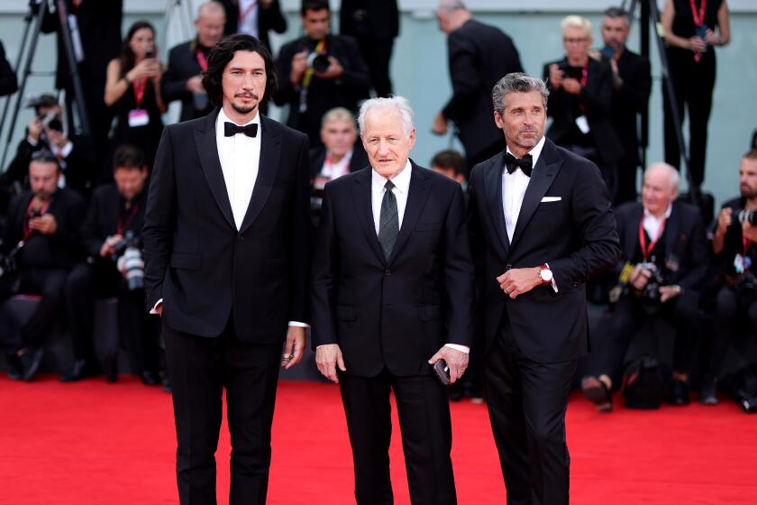 Adam Driver, Michael Mann and Patrick Dempsey attend a red carpet for the movie "Ferrari"