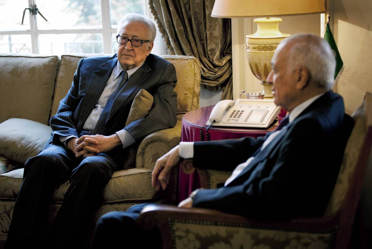 U.N. and Arab League envoy to Syria Lakhdar Brahimi, left, meets with Arab League Secretary-General Nabil Elaraby at Arab League headquarters in Cairo to discuss the Syrian conflict.