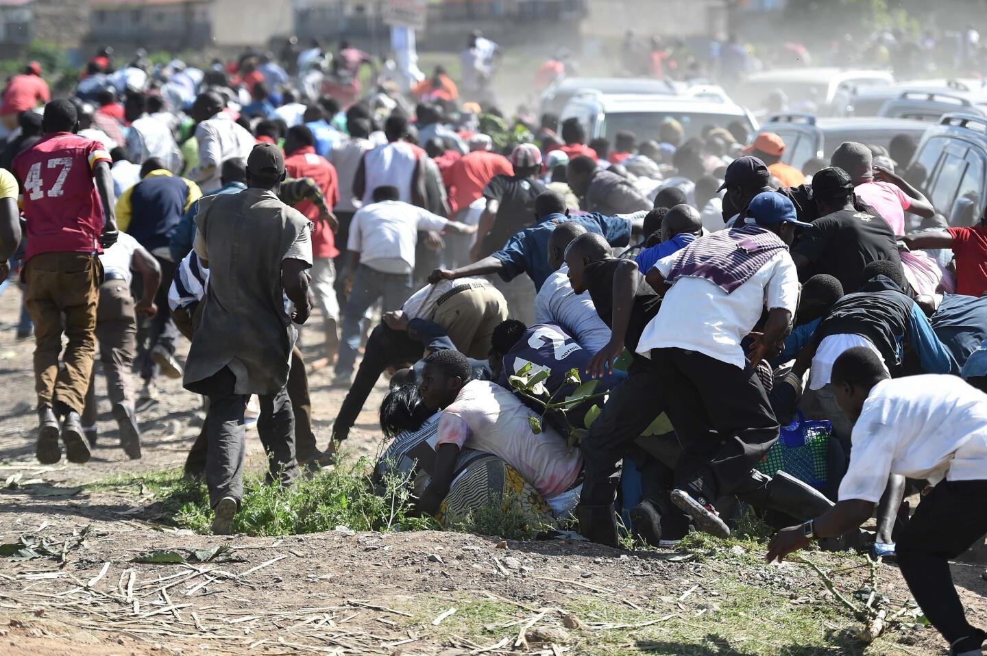 Kenyan president sworn as police fire tear gas to break up opposition gathering