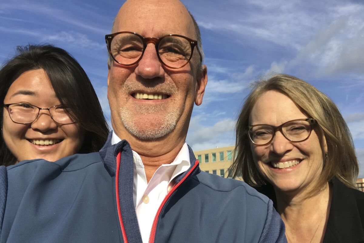Associated Press Cleveland reporter Mark Gillispie takes a selfie with his AP colleagues videojournalist Angie Wang, left, and reporter Julie Carr Smyth, right, who were visiting the city on assignment on Oct. 29, 2019, in Cleveland. Gillispie, a veteran journalist who wrote about many of Ohio's biggest stories and characters during a four-decade career primarily with AP and The Plain Dealer, died Sunday, Jan. 29, 2023, at age 63, according to his family. (AP Photo/Mark Gillispie)