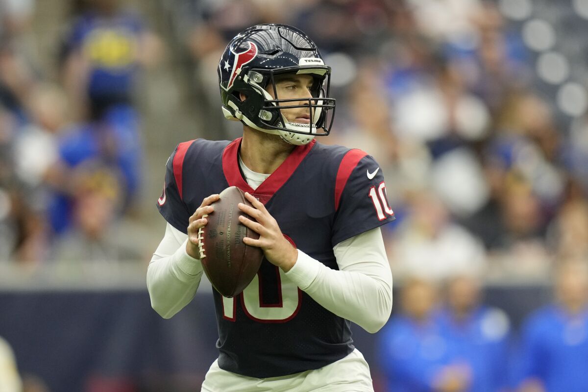 Houston Texans quarterback Davis Mills (10) looks to throw against the Los Angeles Rams during the first half of an NFL football game, Sunday, Oct. 31, 2021, in Houston. (AP Photo/Eric Smith)