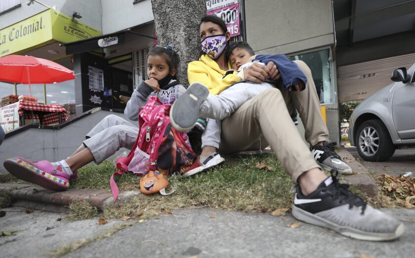 Venezuelan migrant Katerine Valero and her children rest