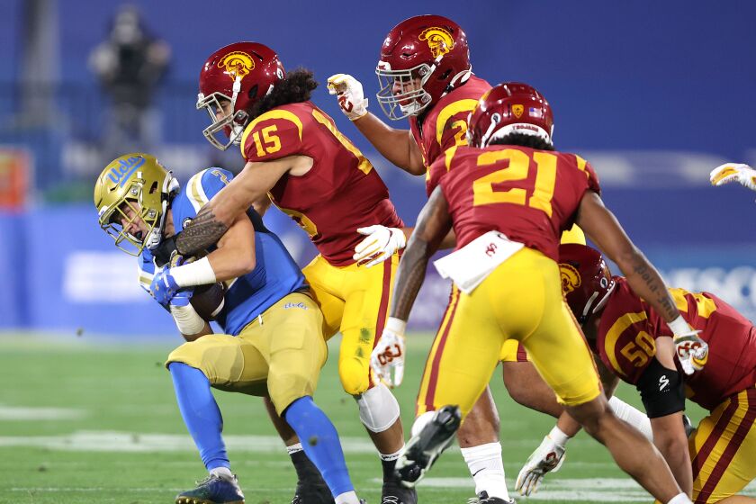USC safety Talanoa Hufanga tackles UCLA wide receiver Kyle Philips during the first half Dec. 12, 2020.