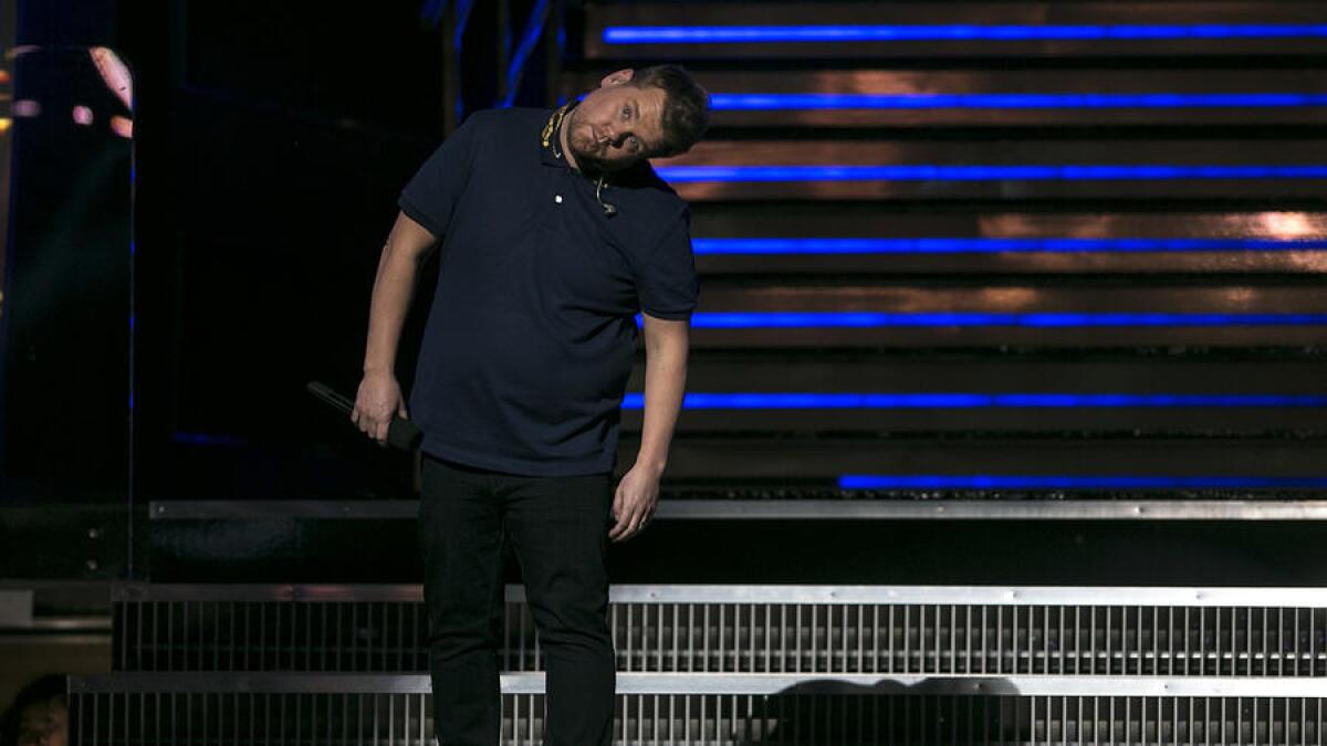 Host James Corden stretches during a break in rehearsal for the 59th Grammy Awards at Staples Center.