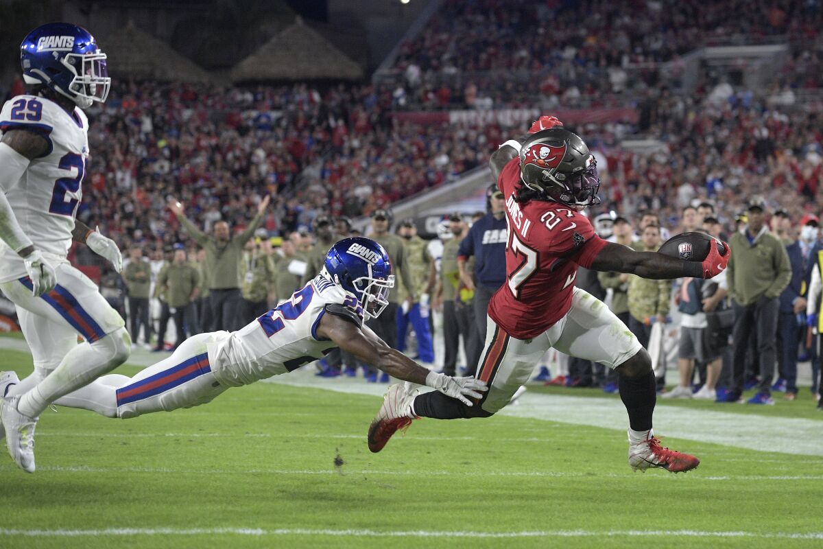 Tampa Bay Buccaneers running back Ronald Jones stretches over the goal line for a six-yard rushing touchdown.