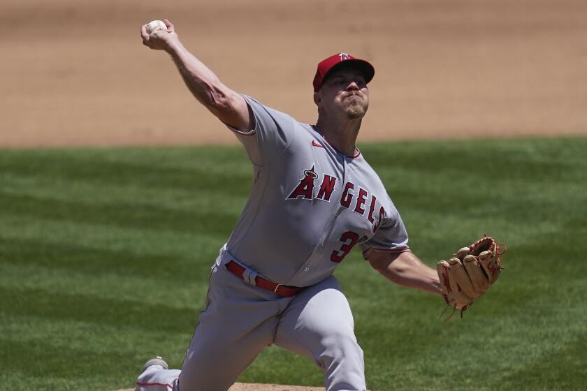 Los Angeles Angels pitcher Dylan Bundy throws against the Oakland Athletics.