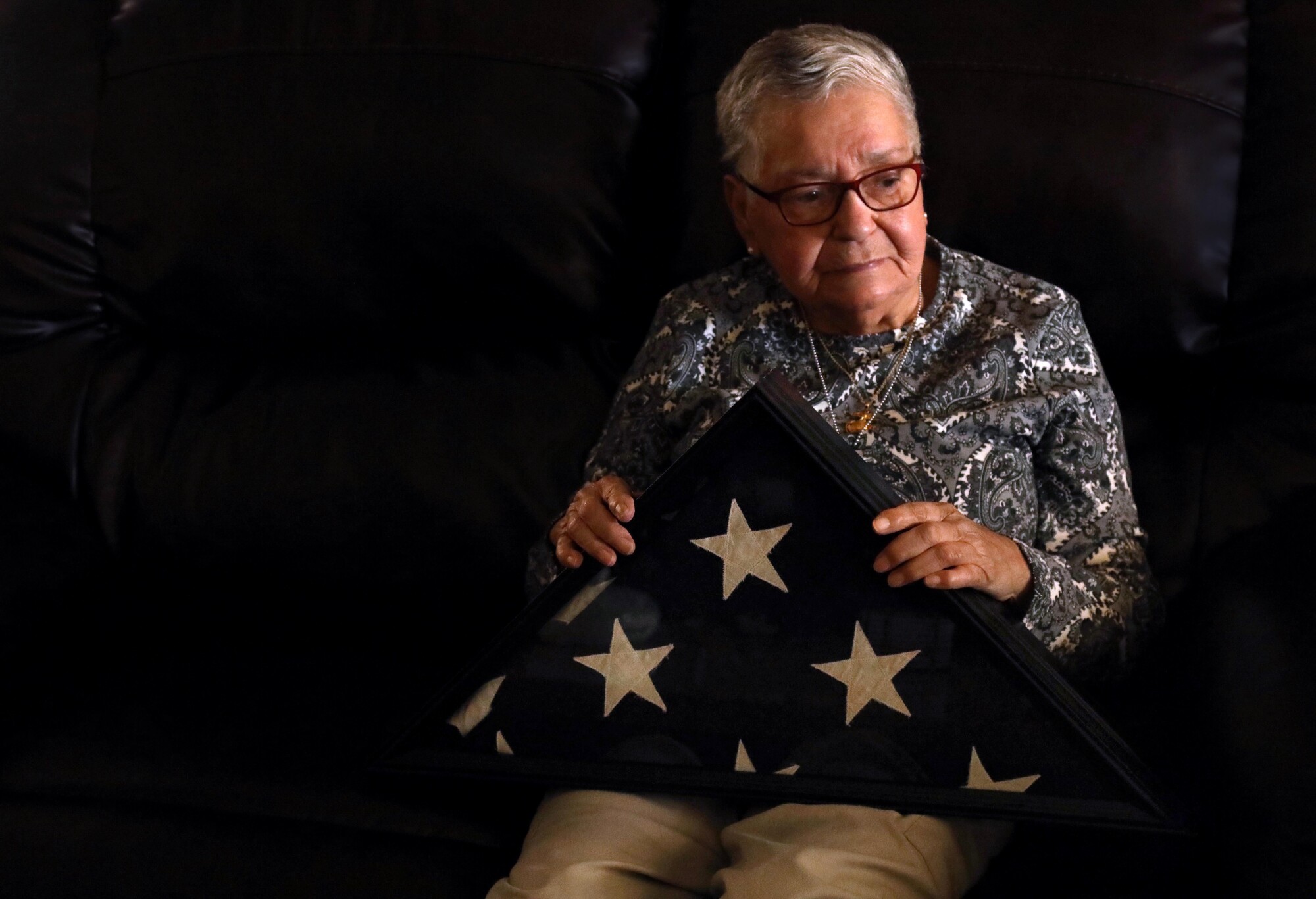 Ruth Soto holds an American flag