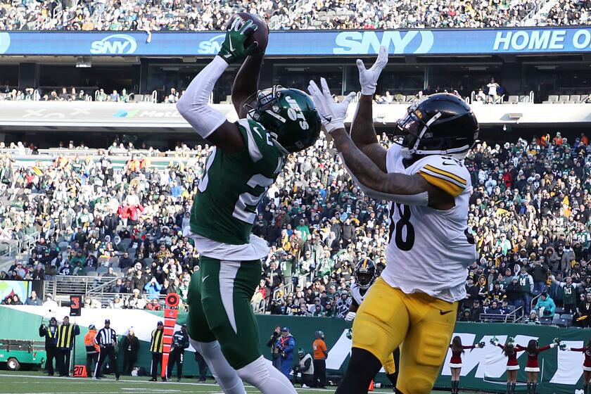 EAST RUTHERFORD, NEW JERSEY - DECEMBER 22: Marcus Maye #20 of the New York Jets intercepts the ball in the end zone against Jaylen Samuels #38 of the Pittsburgh Steelers during their game at MetLife Stadium on December 22, 2019 in East Rutherford, New Jersey. (Photo by Al Bello/Getty Images)