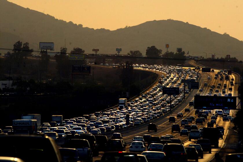 Gina Ferazzi –– – 054512.ME.1017.sprawl1.GMF–Rush hour traffic eastbound on the 91 freeway is bumber to bumber for commuters heading into the Inland Empire near Green River Drive in Corona.(Gina Ferazzi/LAT)
