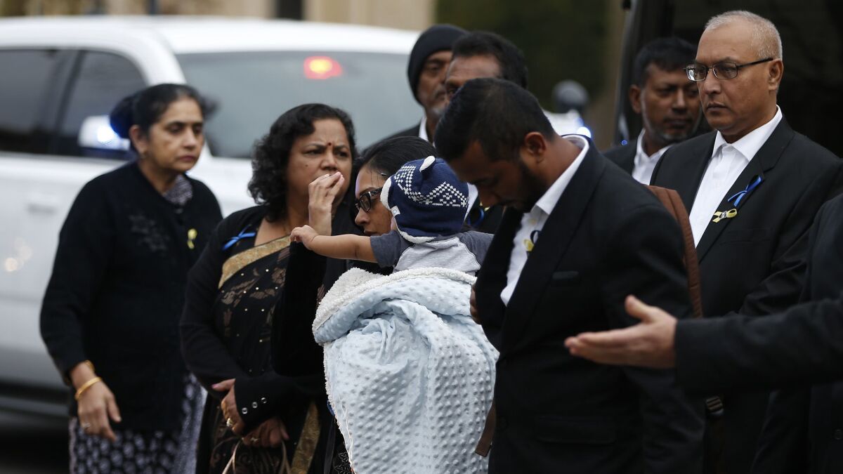 The widow and other relatives of slain Newman Police Cpl. Ronil Singh arrive for his funeral service at CrossPoint Community Church on Saturday.