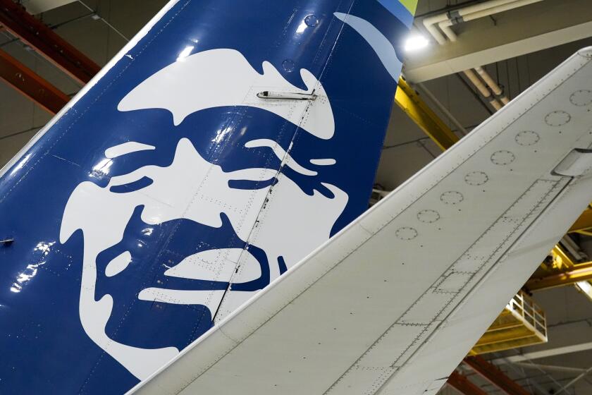 FILE - An Alaska Airlines aircraft sits in the airline's hangar at Seattle-Tacoma International Airport Wednesday, Jan. 10, 2024, in SeaTac, Wash. Alaska Airlines briefly grounded all flights Wednesday, April 17, due to a technical issue. (AP Photo/Lindsey Wasson, File)