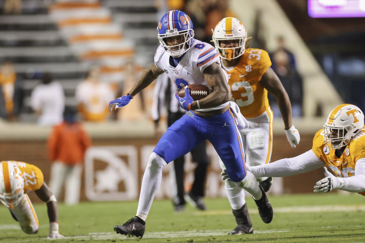 Florida wide receiver Trevon Grimes carries the ball against Tennessee on Saturday.