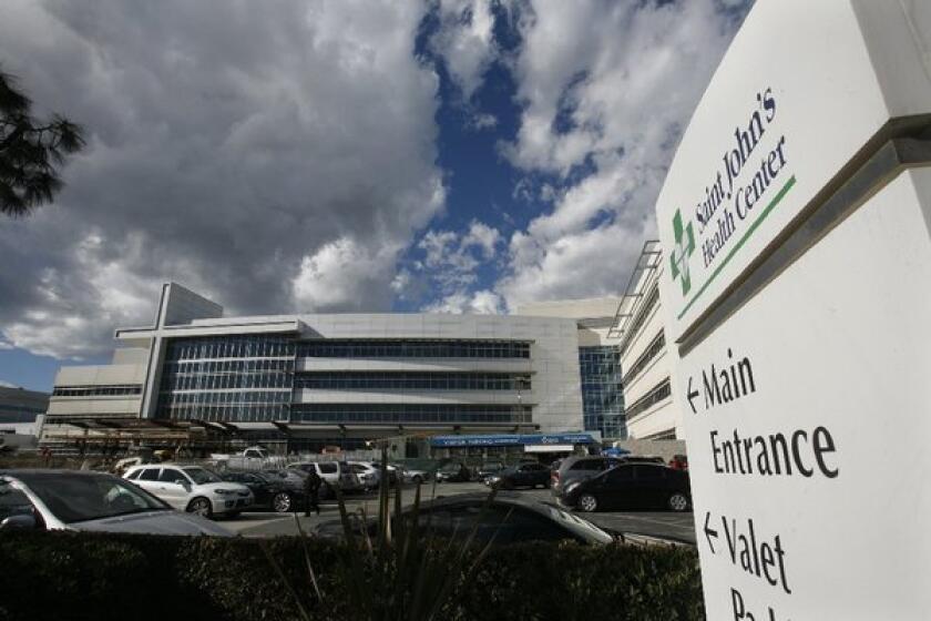 The Denver company that owns St. John's Health Center in Santa Monica has entered into exclusive negotiations with Providence Health & Services on a sale of the medical center.