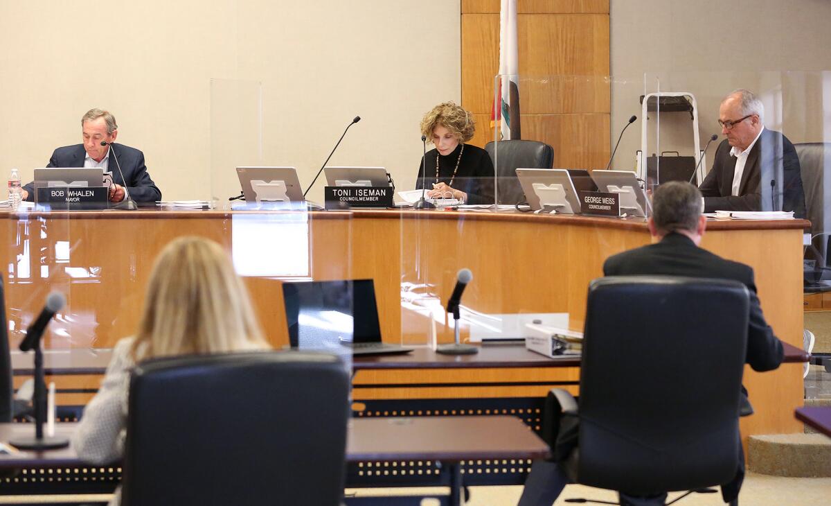 Laguna Beach Mayor Bob Whalen and City Council members Toni Iseman and George Weiss at a meeting on April 6.