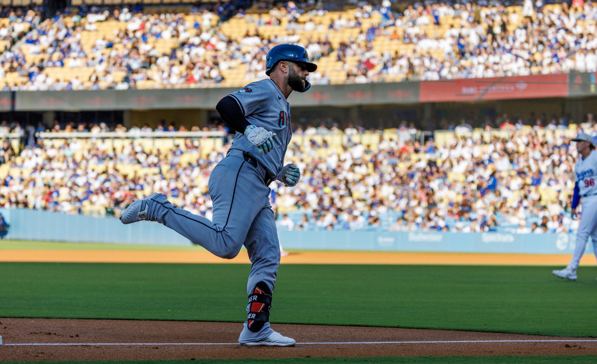 Arizona's Christian Walker rounds third base after hitting a home run in the first inning against the Dodgers.