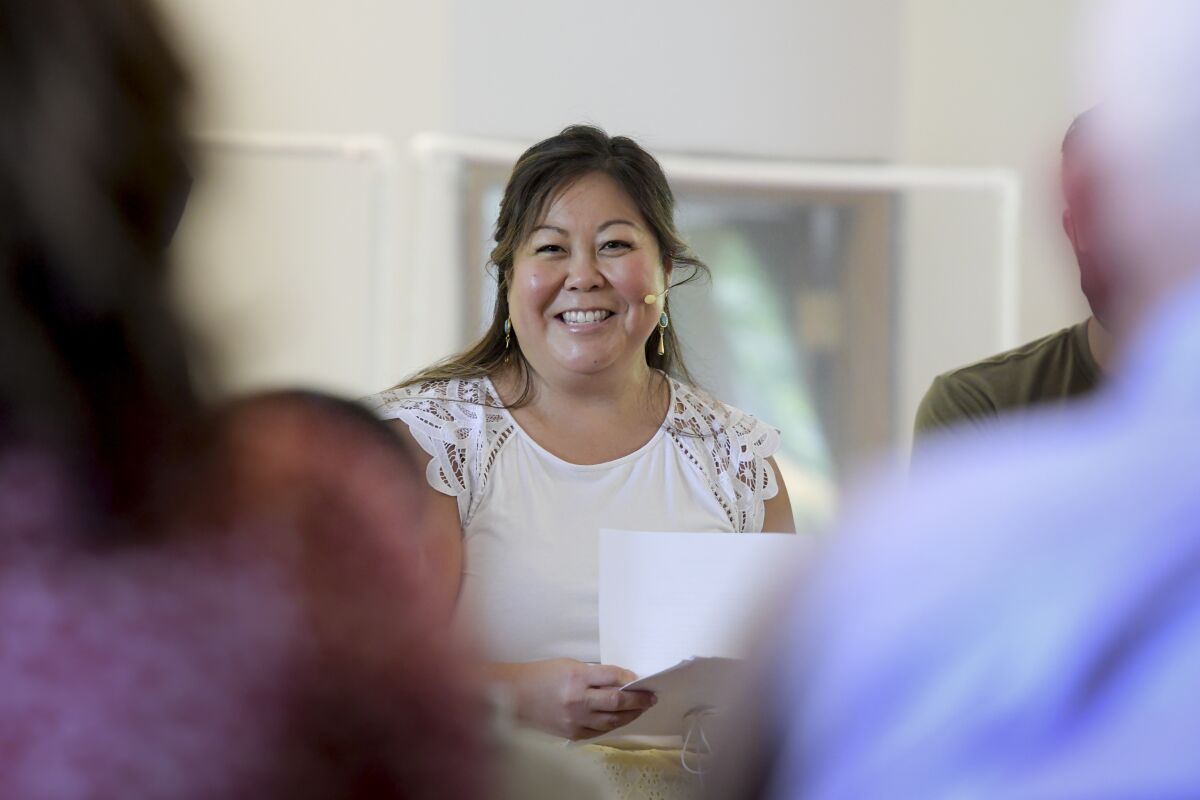 Pastor Juliet Liu of Life on the Vine church speaks during a congregational meeting in Long Grove