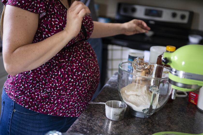Rebecca Grimm makes homemade bread at her home in Westfield, Ind., on Sunday August, 25, 2019. Grimm was pregnant with her second child in 2018 when she suffered a miscarriage but did not pass the fetus. She went on her insurance website to find out how much it would cost to have a surgical procedure to remove the fetus and learned she could expect to pay $700. After a 15 minute procedure, her and her husband were billed almost $6,000. The cost estimator she had been using to shop for medical care did not include all of the charges associated with the procedure.