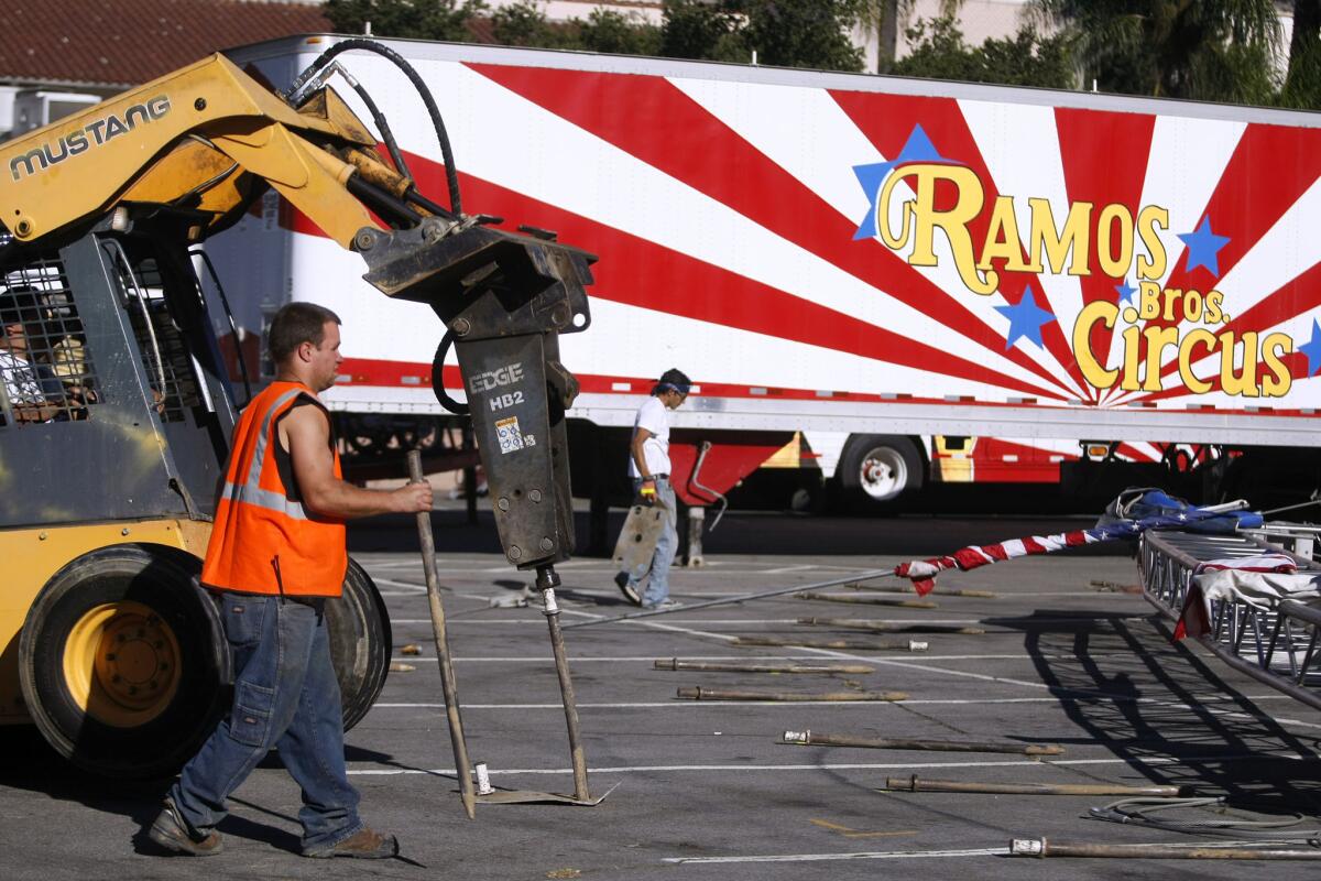 Workers prepare to raise the structure for the Ramos Bros. Circus at the Civic Auditorium parking lot in Glendale on Wednesday, Nov. 13, 2013.