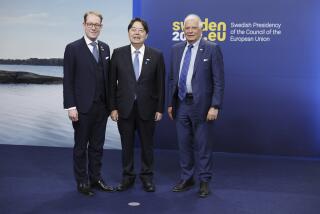 Yoshimasa Hayashi, center, Minister for Foreign Affairs, Japan, is received by Swedish Foreign Minister Tobias Billstrom, left, and European Union High Representative for Foreign Affairs and Security Policy Josep Borrell for an EU Indo-Pacific Ministerial Forum in connection to an informal meeting of EU foreign affairs ministers in Marsta outside Stockholm, Satursay, May 13, 2023. (Christine Olsson/TT News Agency via AP)