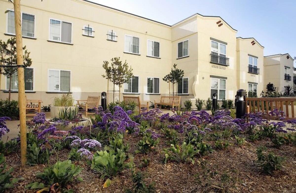 CATCHING RAYS: Casa Dominguez, an environmentally conscious affordable housing development in East Rancho Dominguez, has solar panels on the roof of the multifamily apartment complex.