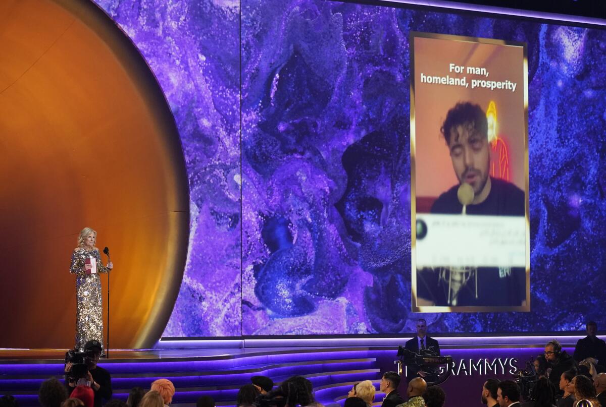First Lady Jill Biden on stage at the Grammys, with an image of Shervin Hajipour