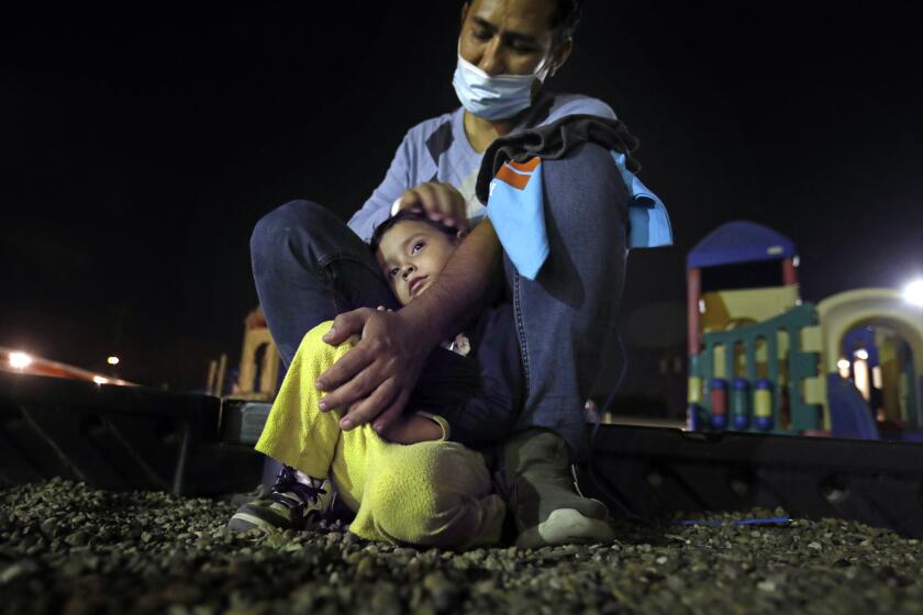 MISSION, TEXAS - Families are sheltered at the Our Ladyof Guadalupe Catholic Church in Mission, Texas, after being released from immigration on March 16, 2021. Johnny and his 3-year-old son Justin arrived at the shelter on March 16,2021 after being released from immigration. They came with Johnny's wife as a family from San Pedro Sula, Honduras. Tuesday, March 16, 2021 in Mission, Texas. (Carolyn Cole / Los Angeles Times)