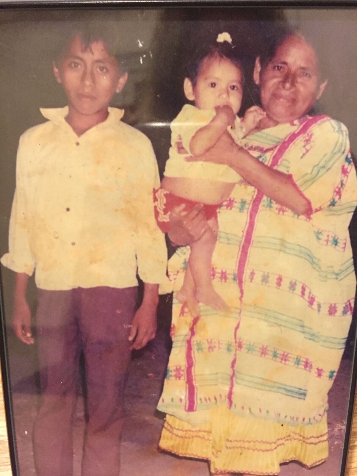 Ignacio, who for years people knew only as "Sixty-Six Garage," at left with his mother and his niece. He's about 12 years old in the picture. He has a sister in Ohio.