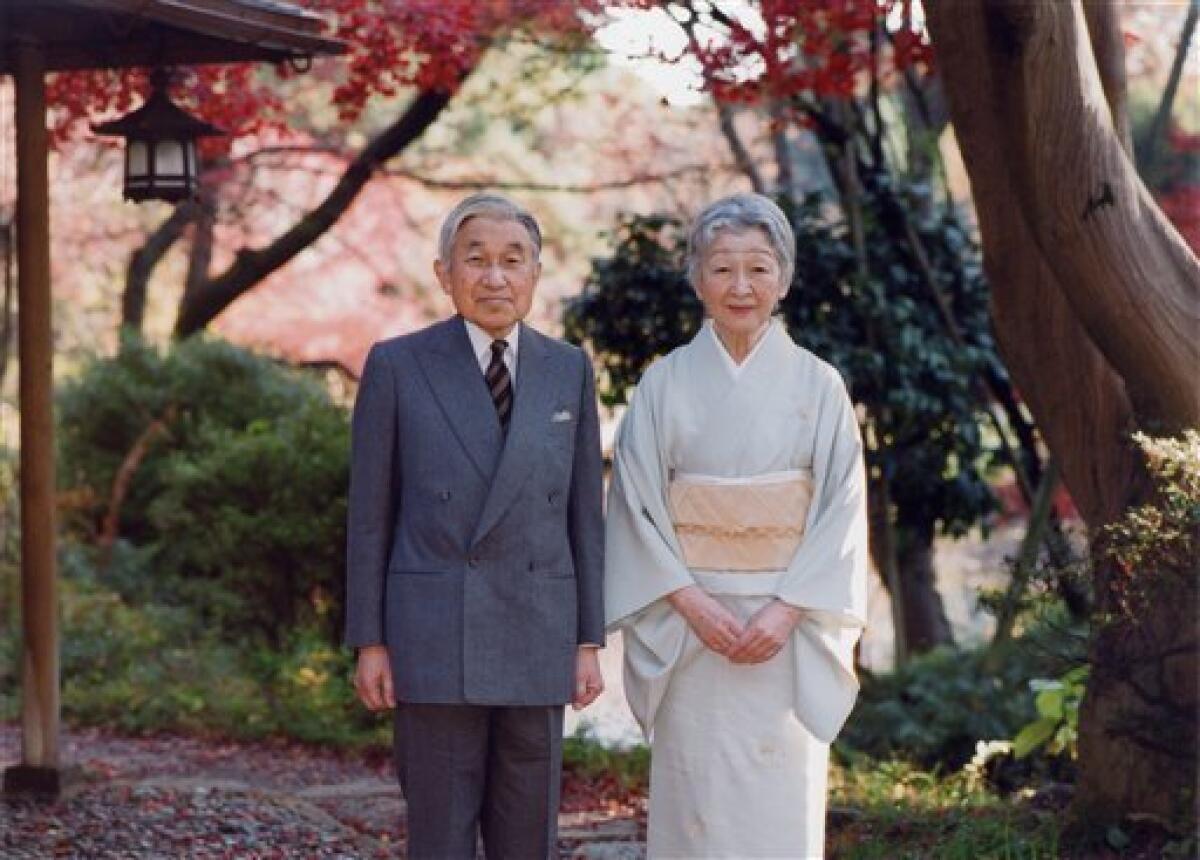 In this photo taken on Monday, Nov. 29, 2010 and released by the Imperial Household Agency of Japan, Emperor Akihito and Empress Michiko stand together by Sokintei arbor during their stroll at Fukiage Garden in the Imperial Palace in Tokyo. Akihito celebrates his 77th birthday Thursday, Dec. 23, 2010. (AP Photo/Imperial Household Agency of Japan) EDITORIAL USE ONLY