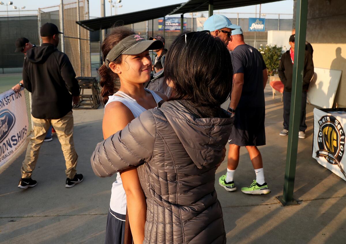 Marina singles player Mika Ikemori is embraced by her mother Lynn at Whittier Narrows Tennis Center.