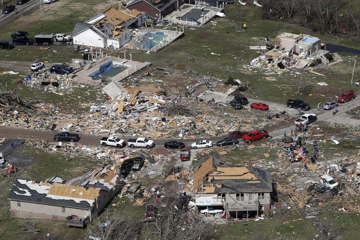 Deadly tornadoes ripped across Tennessee early Tuesday, shredding more than 140 buildings and burying people in piles of rubble and wrecked basements.