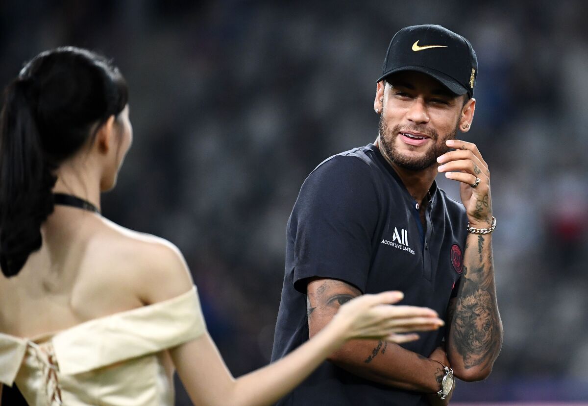 Paris Saint-Germain's Brazilian forward Neymar arrives on the podium at the end of the French Trophy of Champions football match between Paris Saint-Germain (PSG) and Rennes (SRFC) at the Shenzhen Universiade stadium in Shenzhen on August 3, 2019. (Photo by FRANCK FIFE / AFP)FRANCK FIFE/AFP/Getty Images ** OUTS - ELSENT, FPG, CM - OUTS * NM, PH, VA if sourced by CT, LA or MoD **