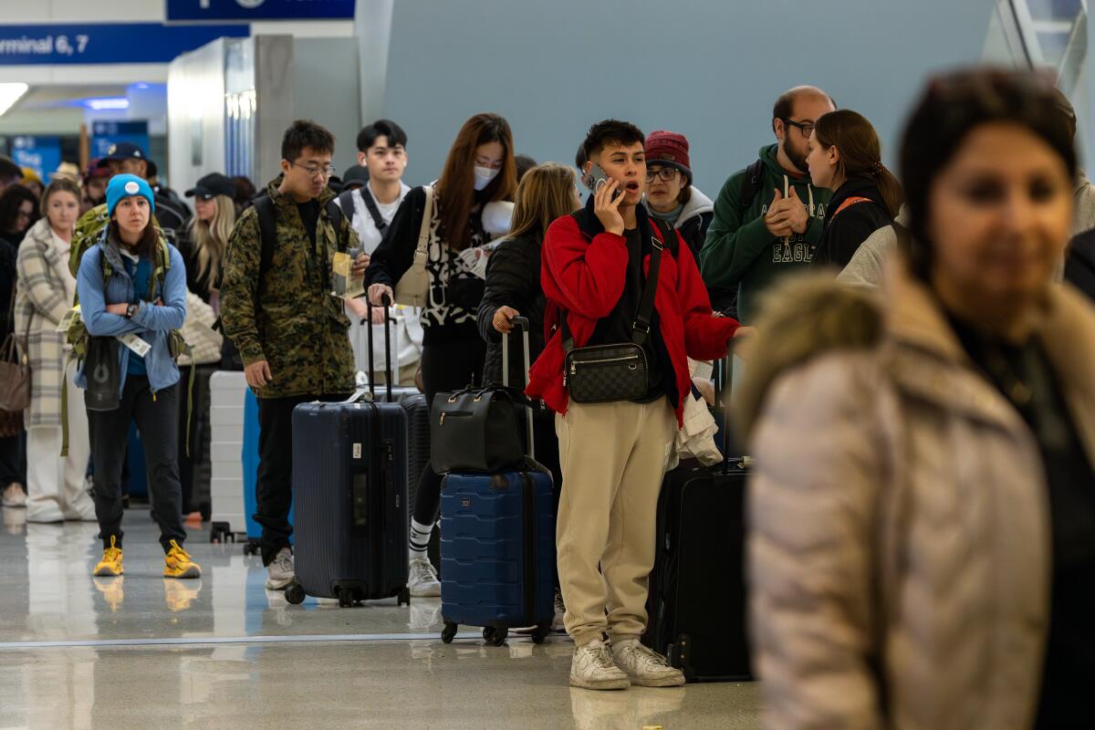 Holiday travelers line up at Los Angeles International Airport 
