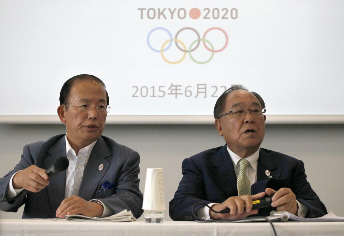 Tokyo 2020 Olympics CEO Toshiro Muto, left, and Honorary President Fujio Mitarai speak during a news conference in Tokyo on Monday to announce that eight sports have been shortlisted for possible addition at the Tokyo summer games.