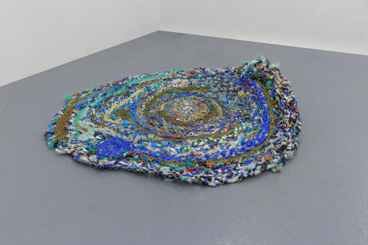 “Pasalubong #10,” a handwoven blue tarp created by artist Carol Anne Almocera McChrystal.
