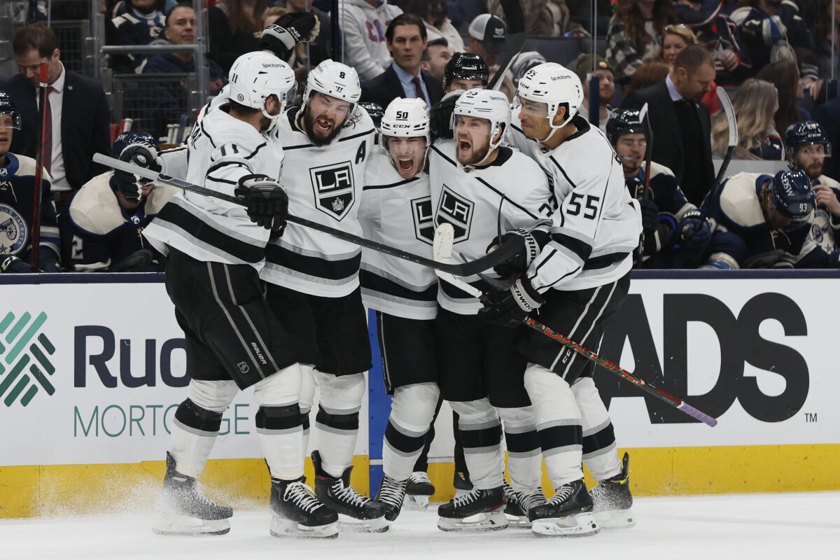 Los Angeles Kings players celebrate a goal against the Columbus Blue Jackets during the third period of an NHL hockey game Friday, March 4, 2022, in Columbus, Ohio. (AP Photo/Jay LaPrete)
