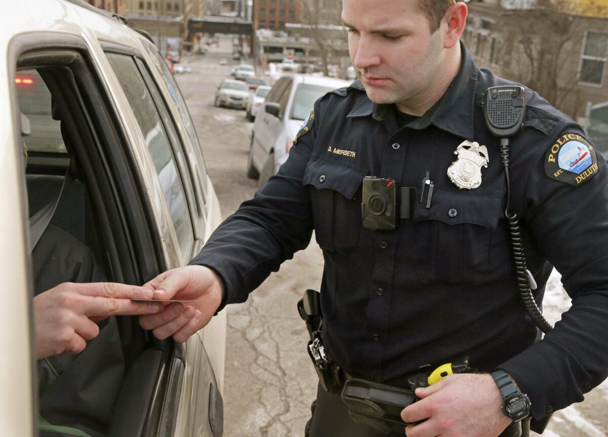 A red light on the body camera worn by Duluth, Minn. police officer Dan Merseth indicates it is active during a traffic stop in February.