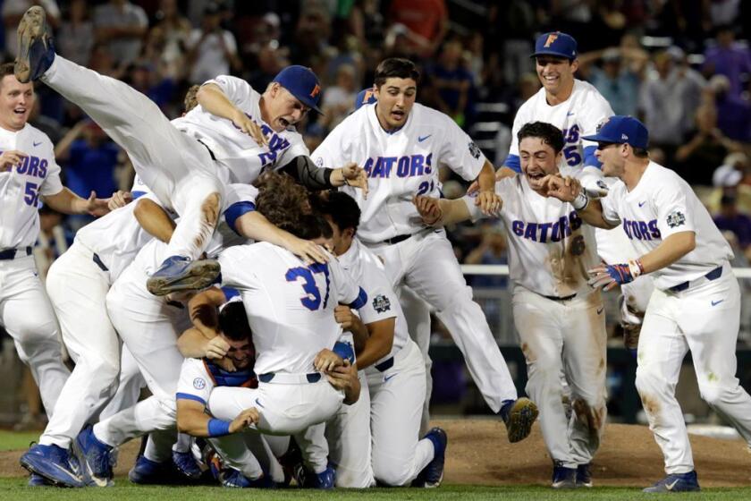Florida players celebrate after defeating LSU in Game 2 to win the NCAA College World Series baseball finals in Omaha, Neb., Tuesday, June 27, 2017. (AP Photo/Nati Harnik)