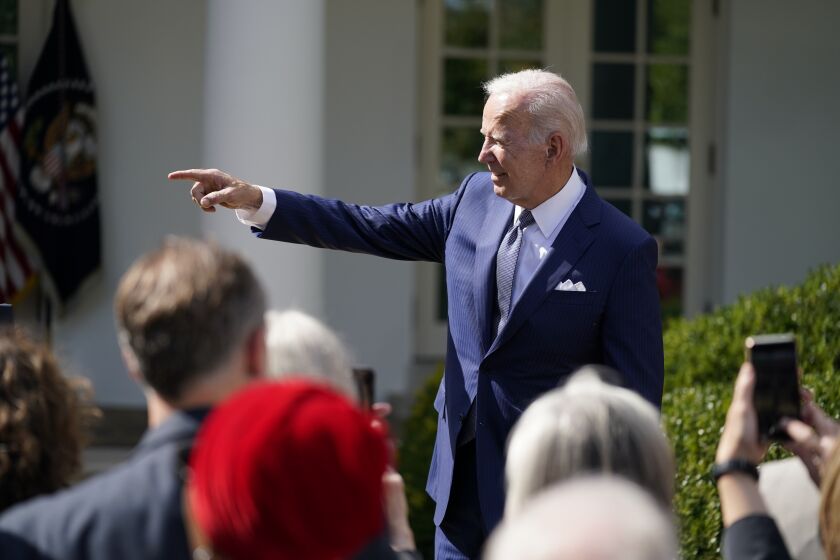President Joe Biden talks to people after speaking during an event on health care costs, in the Rose Garden of the White House, Tuesday, Sept. 27, 2022, in Washington. (AP Photo/Evan Vucci)