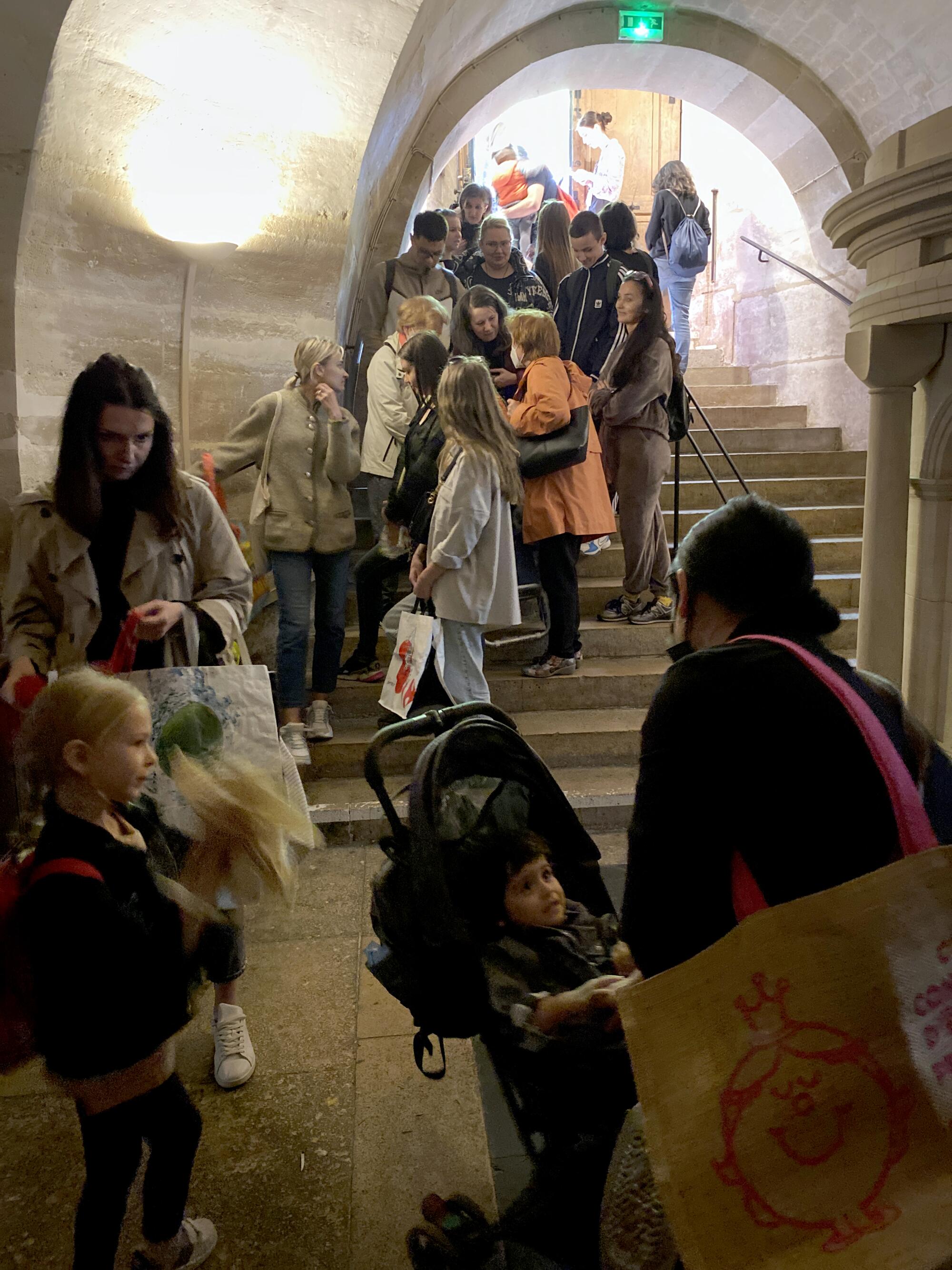 Ukrainian refugees at a church to get food and clothing.