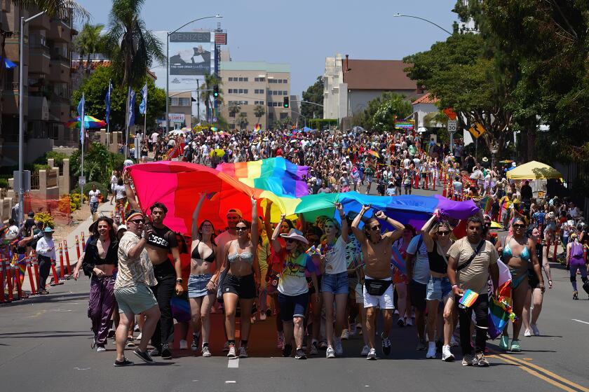 San Diego, CA - July 15: At Pride Parade in San Diego, participants carry the large Pride flag down Sixth Avenue towards Balboa Park on Saturday, July 15, 2023 in San Diego, CA. (Nelvin C. Cepeda / The San Diego Union-Tribune)