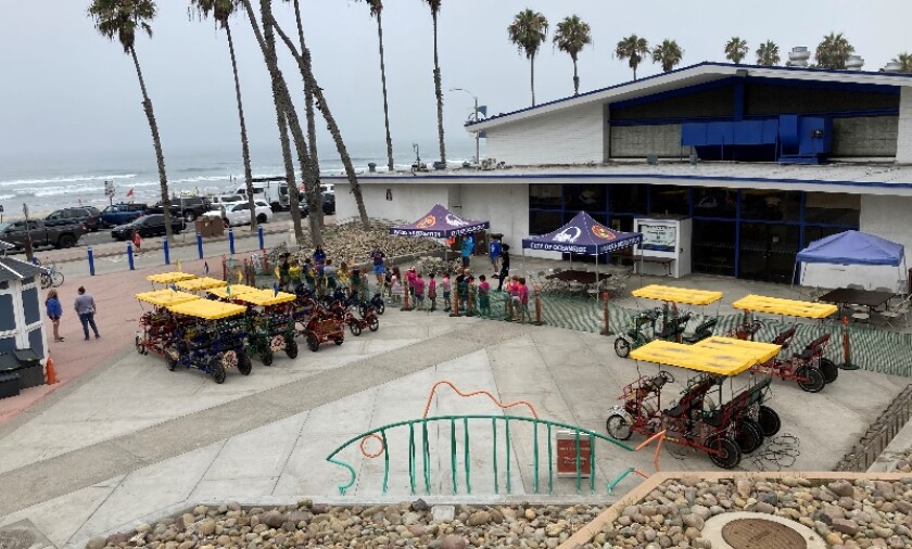 Kids line up for an activity outside the Junior Seau Beach Community Center in Oceanside.