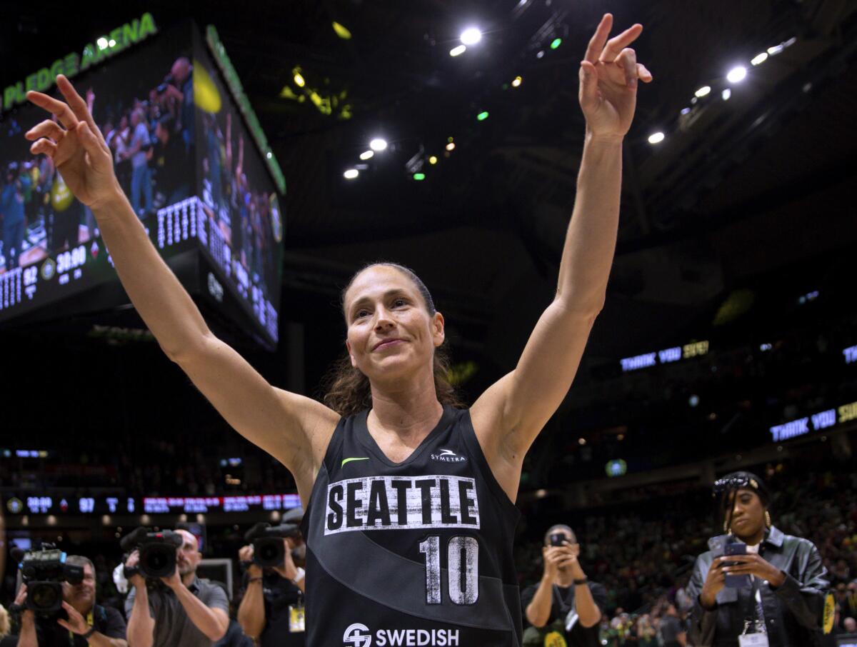Seattle Storm guard Sue Bird (10) waves to fans chanting her name after the Storm lost to the Las Vegas Aces and were eliminated from the playoffs, in Game 4 of a WNBA basketball semifinal Tuesday, Sept. 6, 2022, in Seattle. The Aces won 97-92. (AP Photo/Lindsey Wasson)