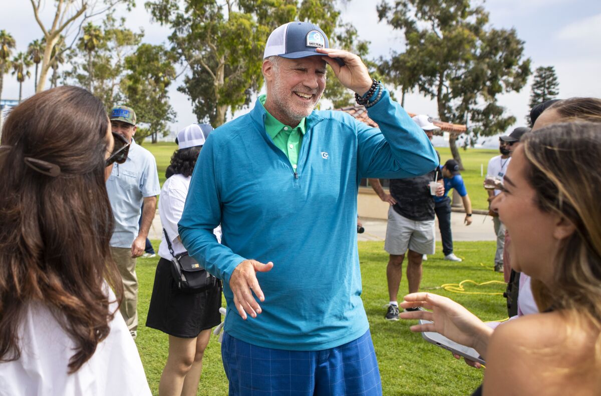 Actor and comedian Will Ferrell talks with fans Friday during a Cancer for College golf event at Coronado Golf Course.