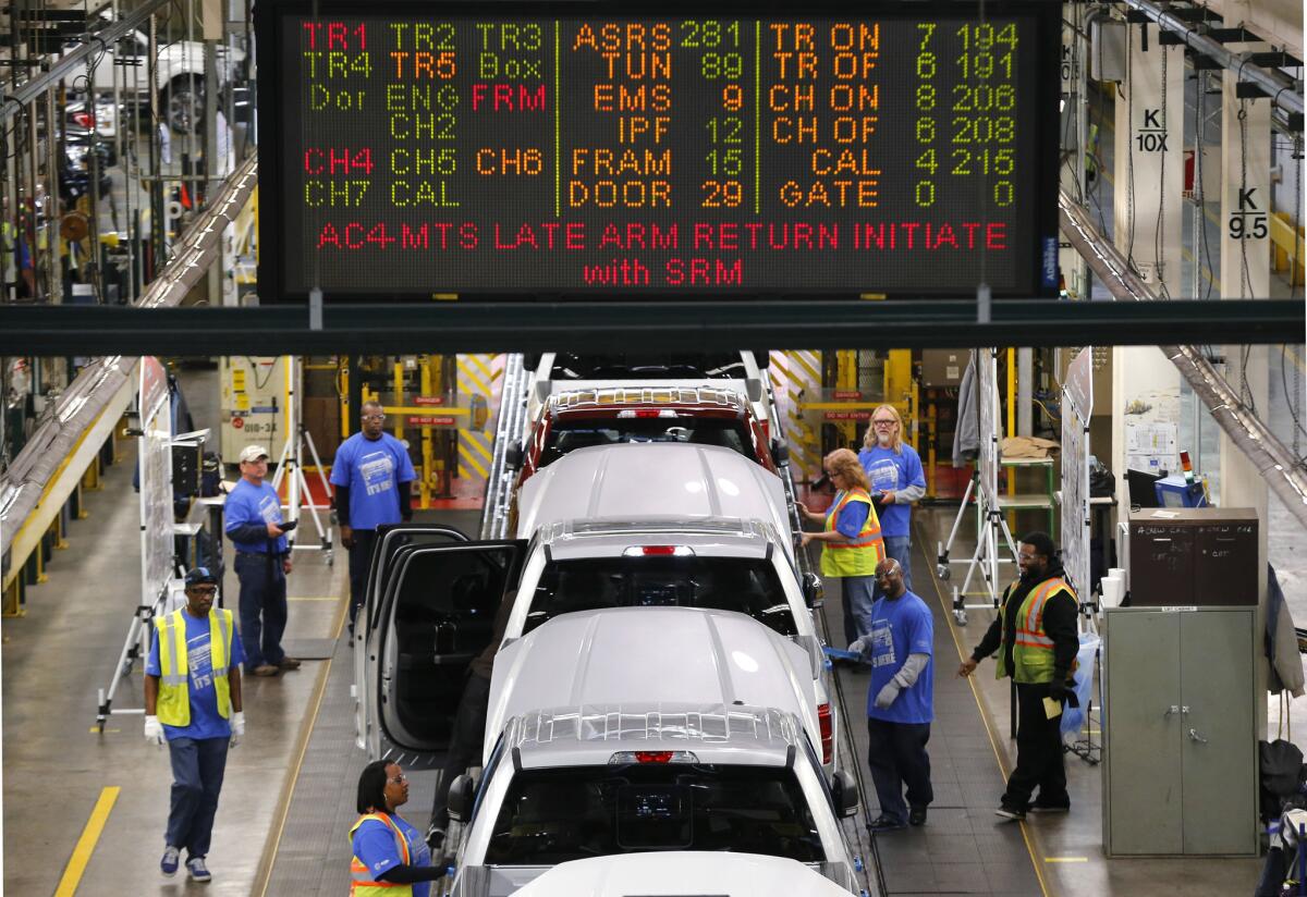 Ford F-150s move along the production line at the Dearborn Truck Plant in Dearborn, Mich., on Nov. 11.