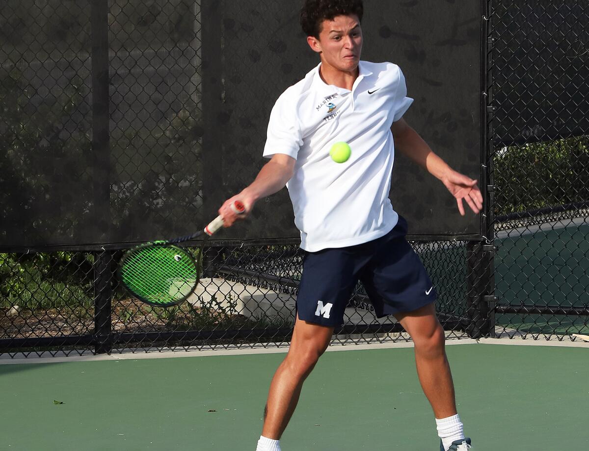 Marina's Alejandro Hill returns a serve against Woodbridge during the CIF Southern Section Division 1 title match on Friday.