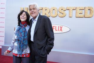 Jay Leno, right, and his wife Mavis smile at the premiere of the film "Unfrosted" at the Egyptian Theatre in Los Angeles