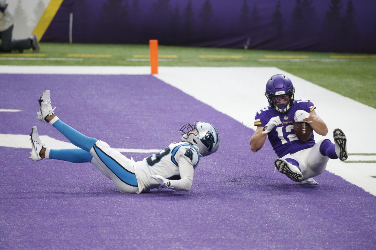 Minnesota Vikings wide receiver Chad Beebe catches a 10-yard touchdown pass over Carolina Panthers cornerback Corn Elder.