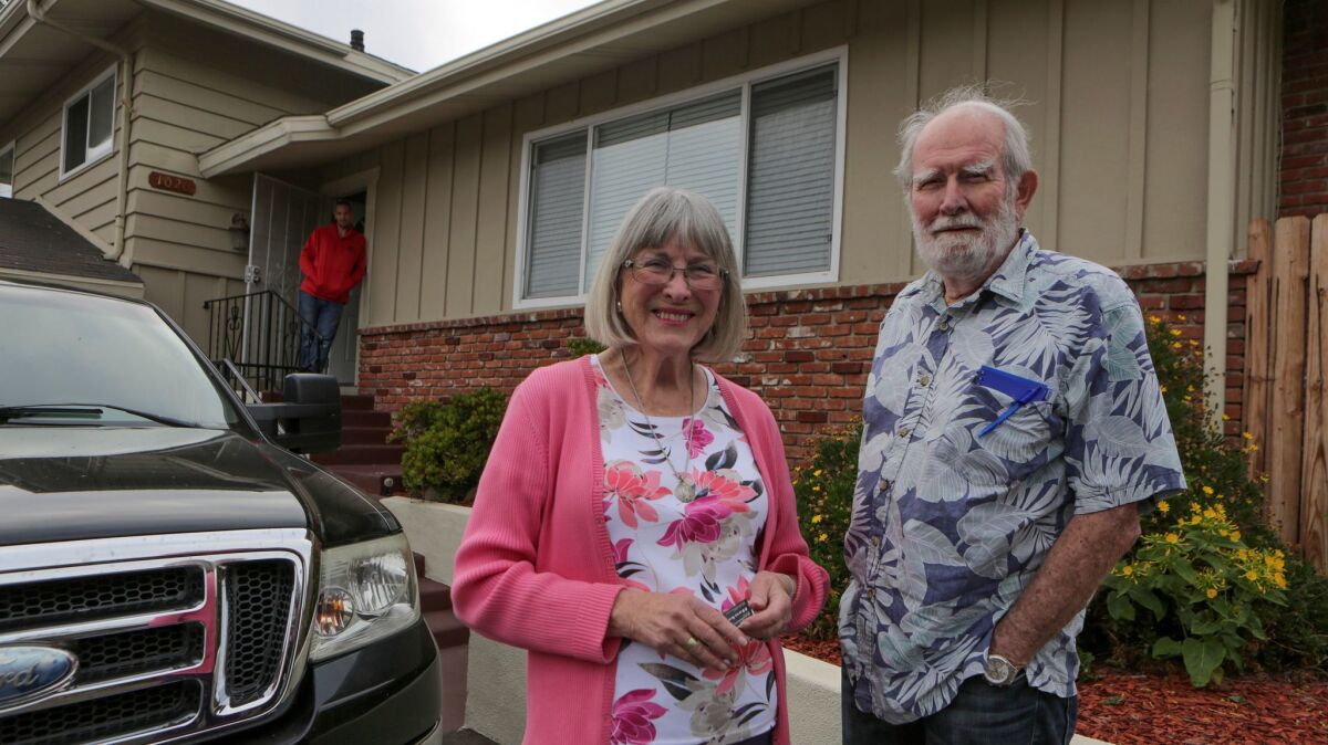 Encinitas residents Joyce and Harley Noel in front of their nonprofit Hawkes Home, a house in Vista that provides low-cost sober living space to men leaving prison.